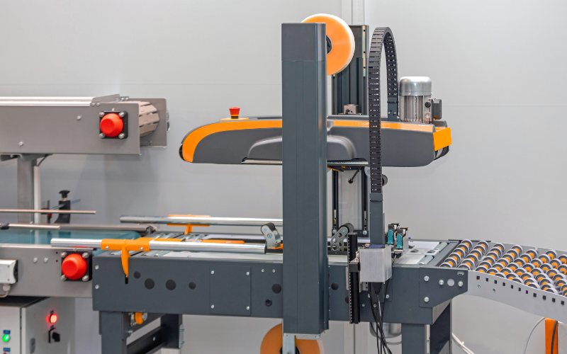 A case sealer - a specialized device designed to automatically seal cartons using adhesive tape or hot melt glue.